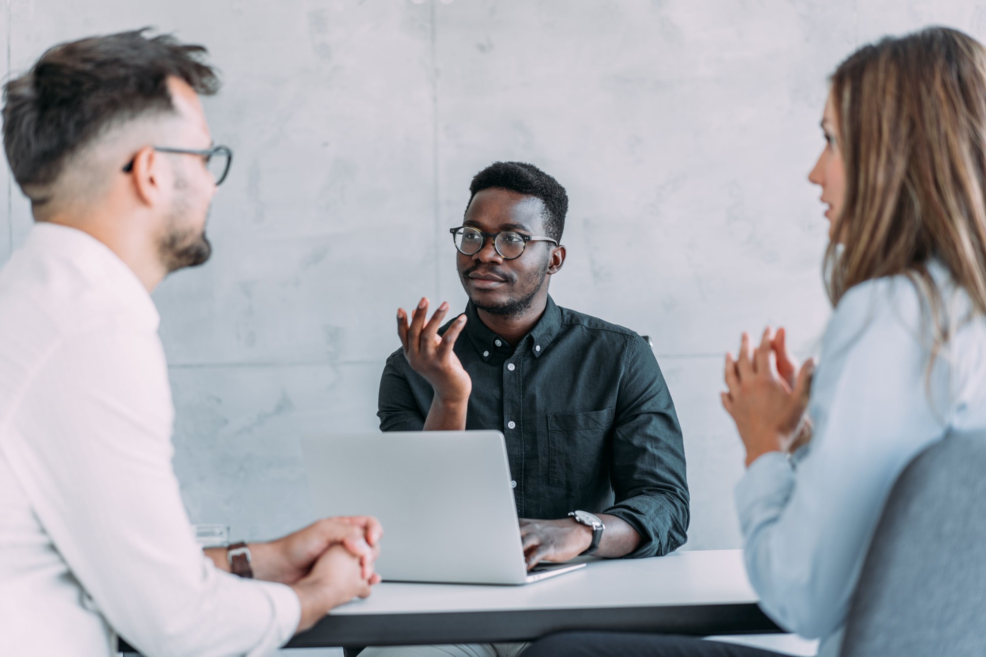 Group of business persons talking in the office.